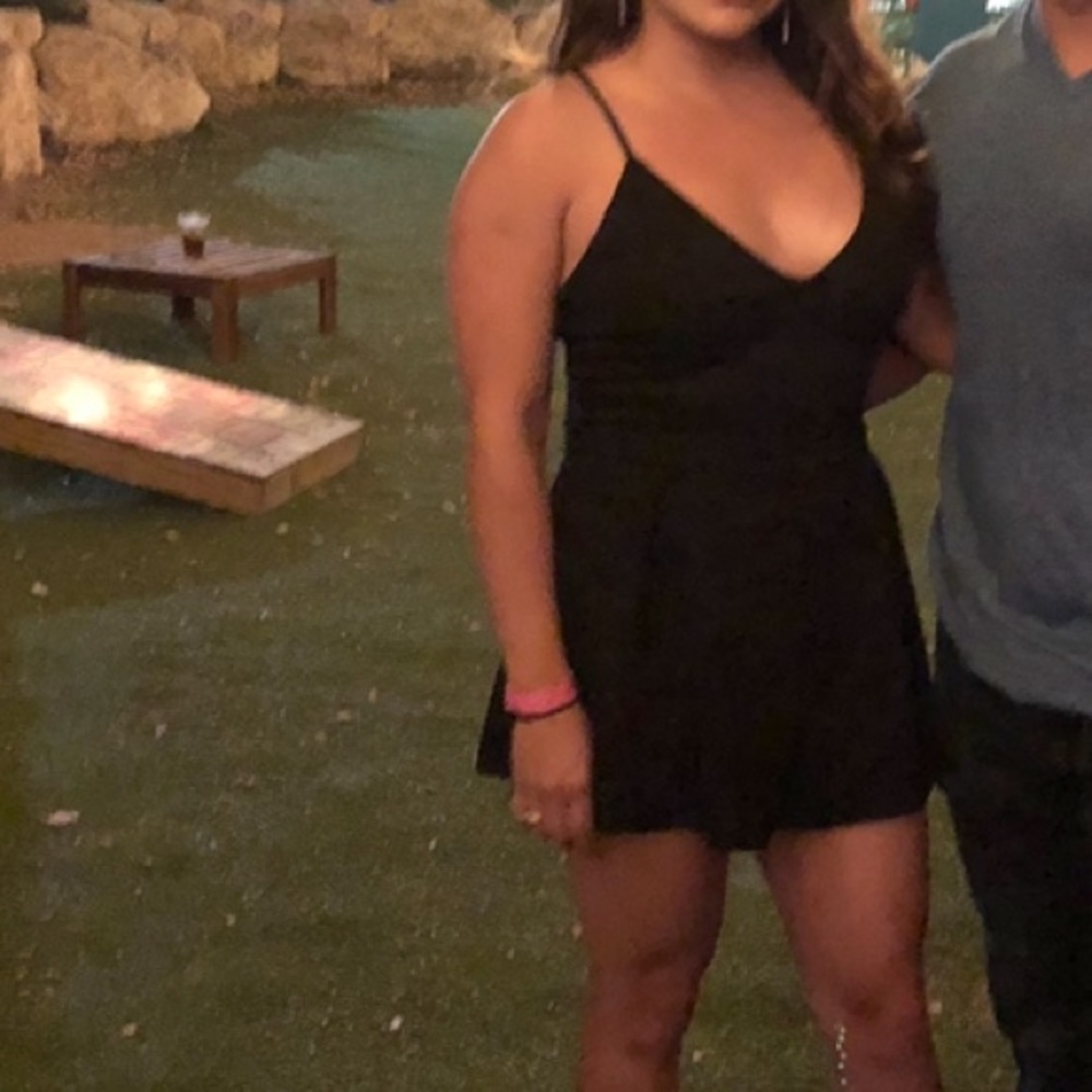 Black romper with open lace back.